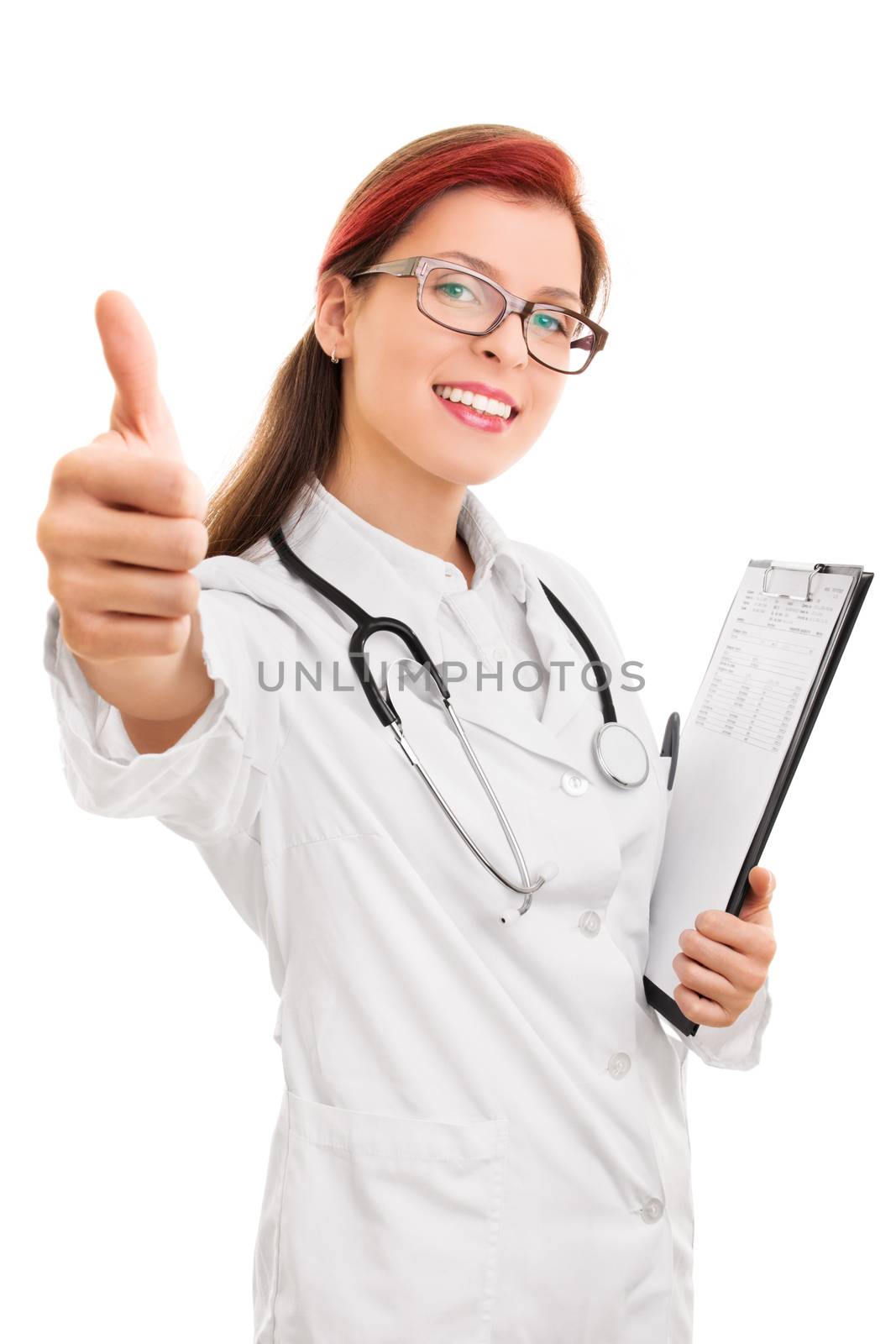 Your health, our commitment. Beautiful young female doctor giving thumbs up, isolated on white background.
