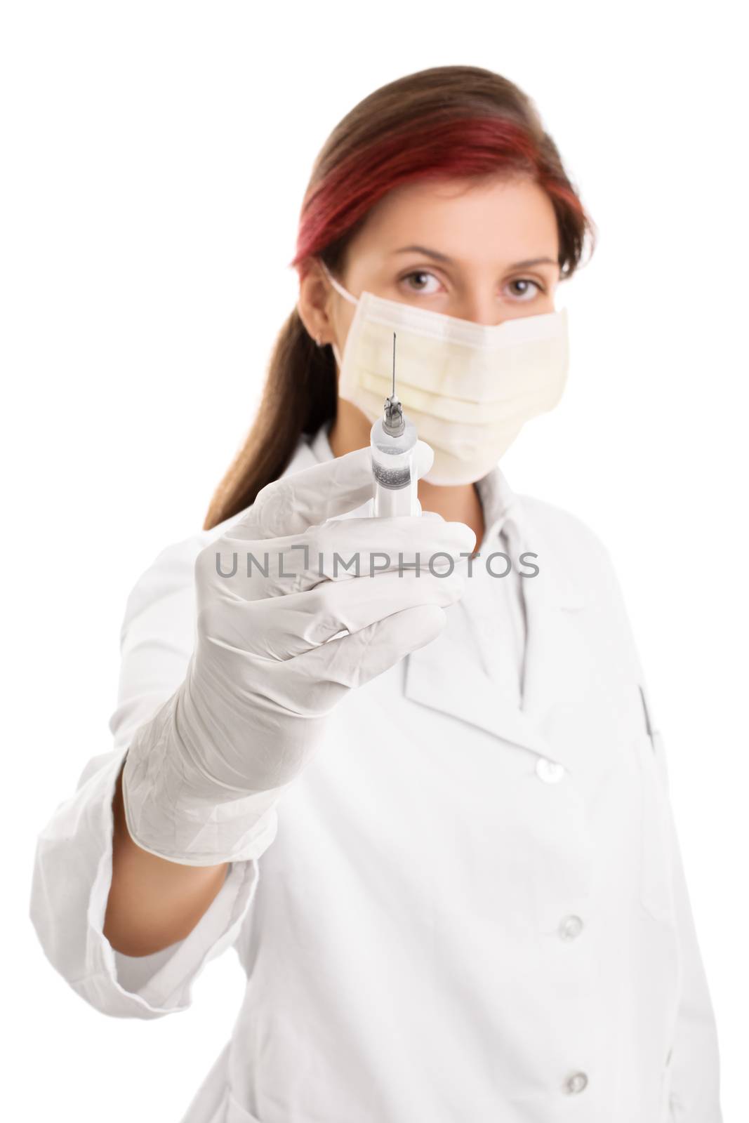 Young doctor wearing surgical mask and holding a syringe with a  by Mendelex