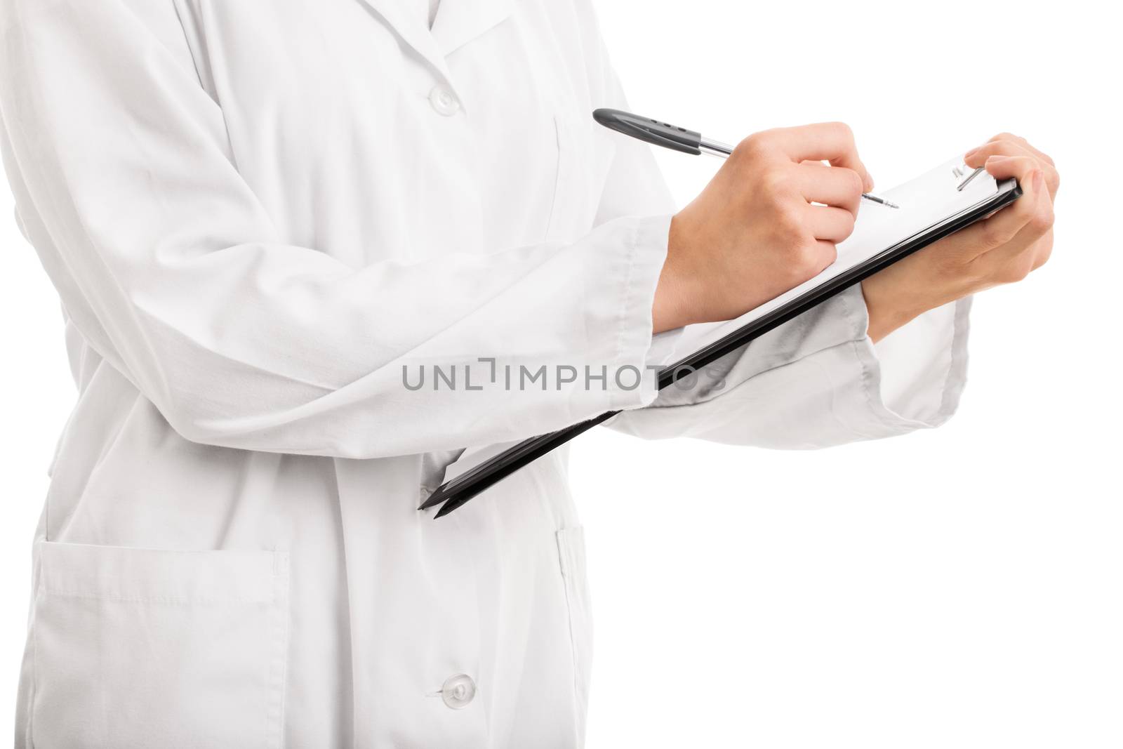 Let me write this down. Young doctor writing on a clipboard, isolated on white background.