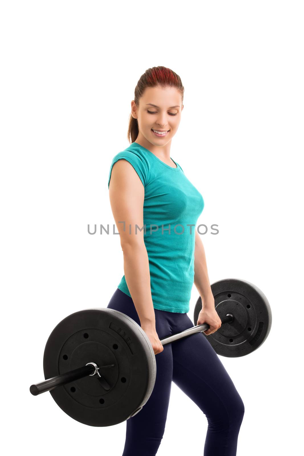 Work it, feel it, love it. It's your figure. Beautiful young girl holding a barbell, isolated on white background. Ready for some deadlifts.