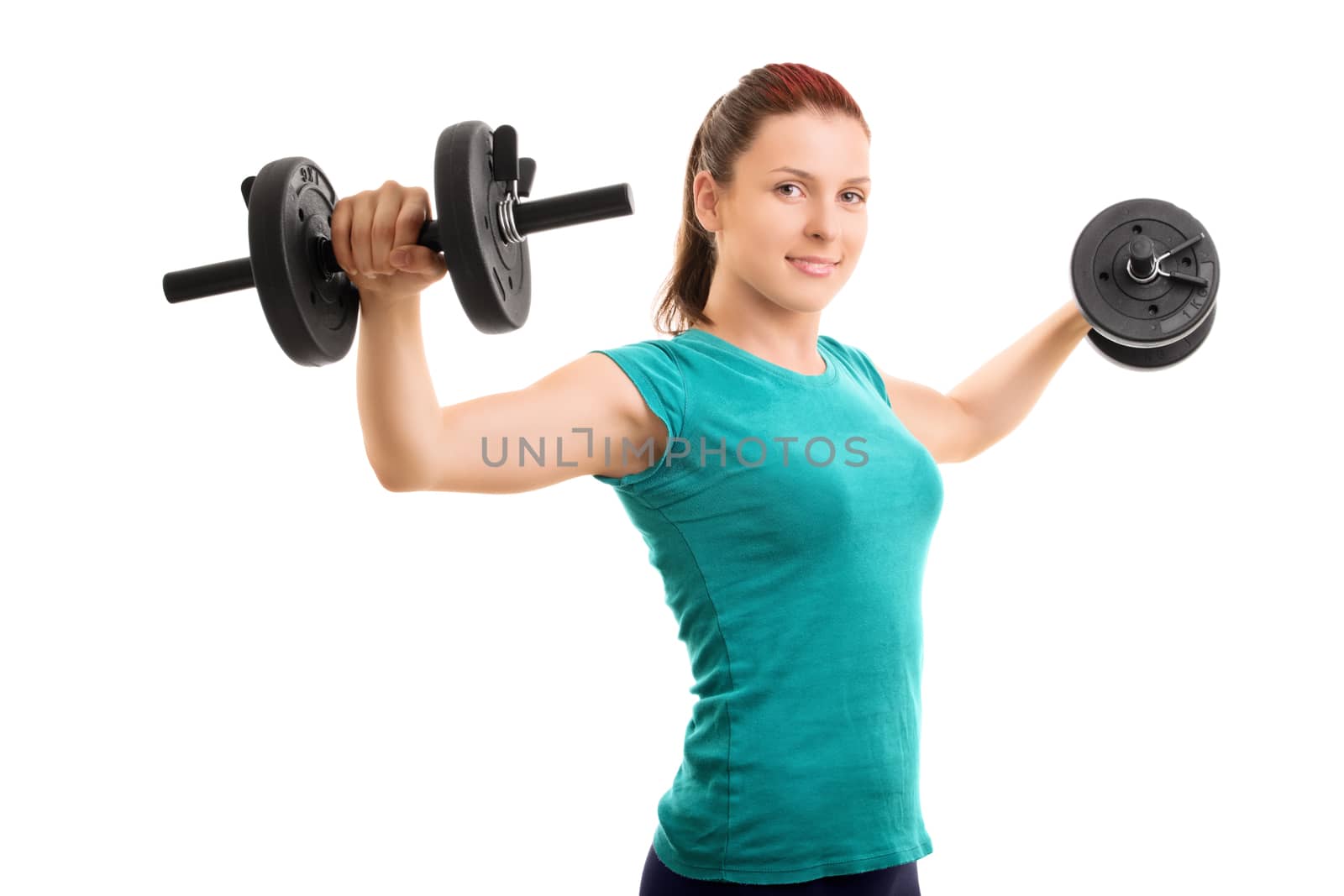 Hold them up! Beautiful young girl lifting dumbbells, isolated on white background.