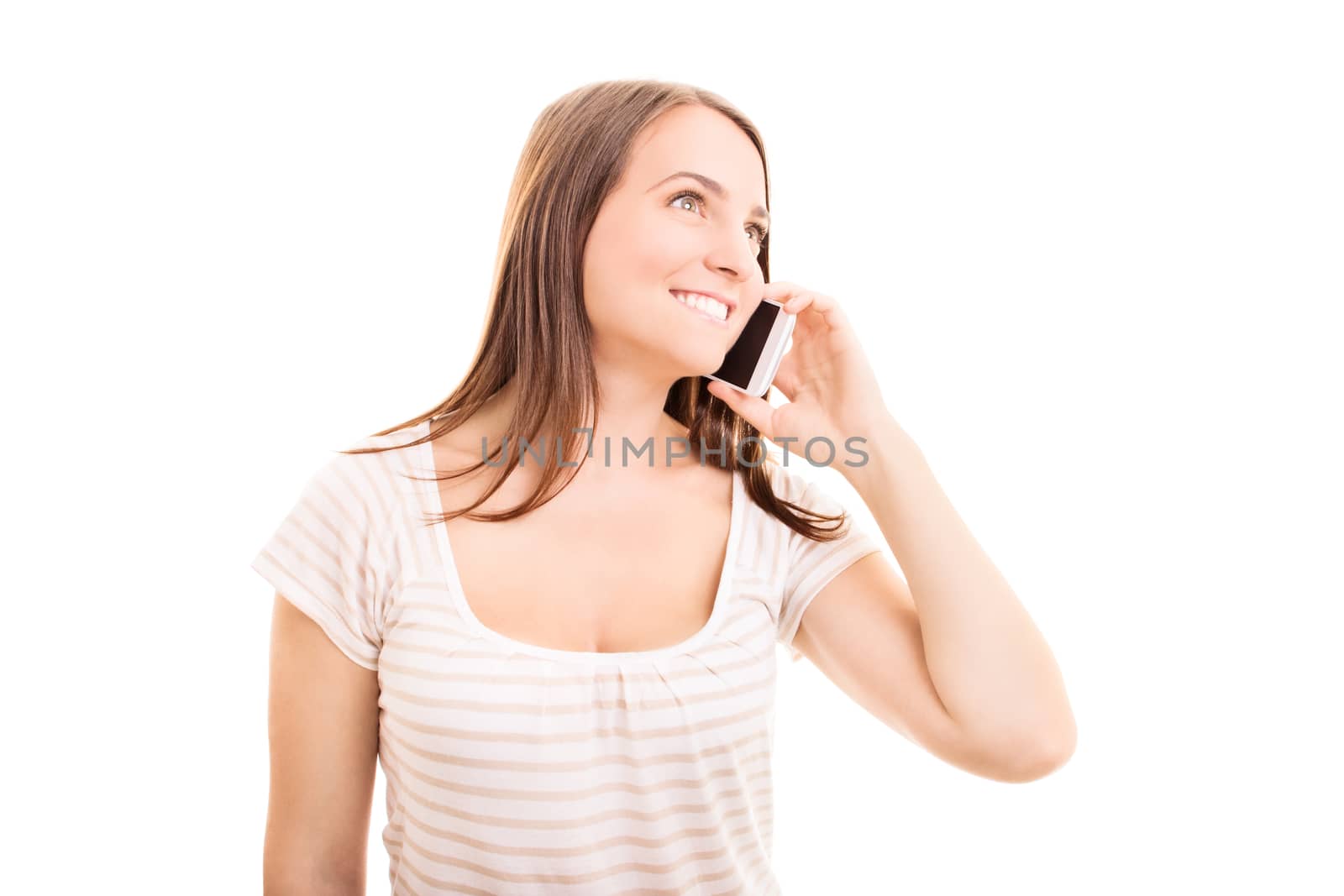 Beautiful young girl talking on a phone, isolated on white background.