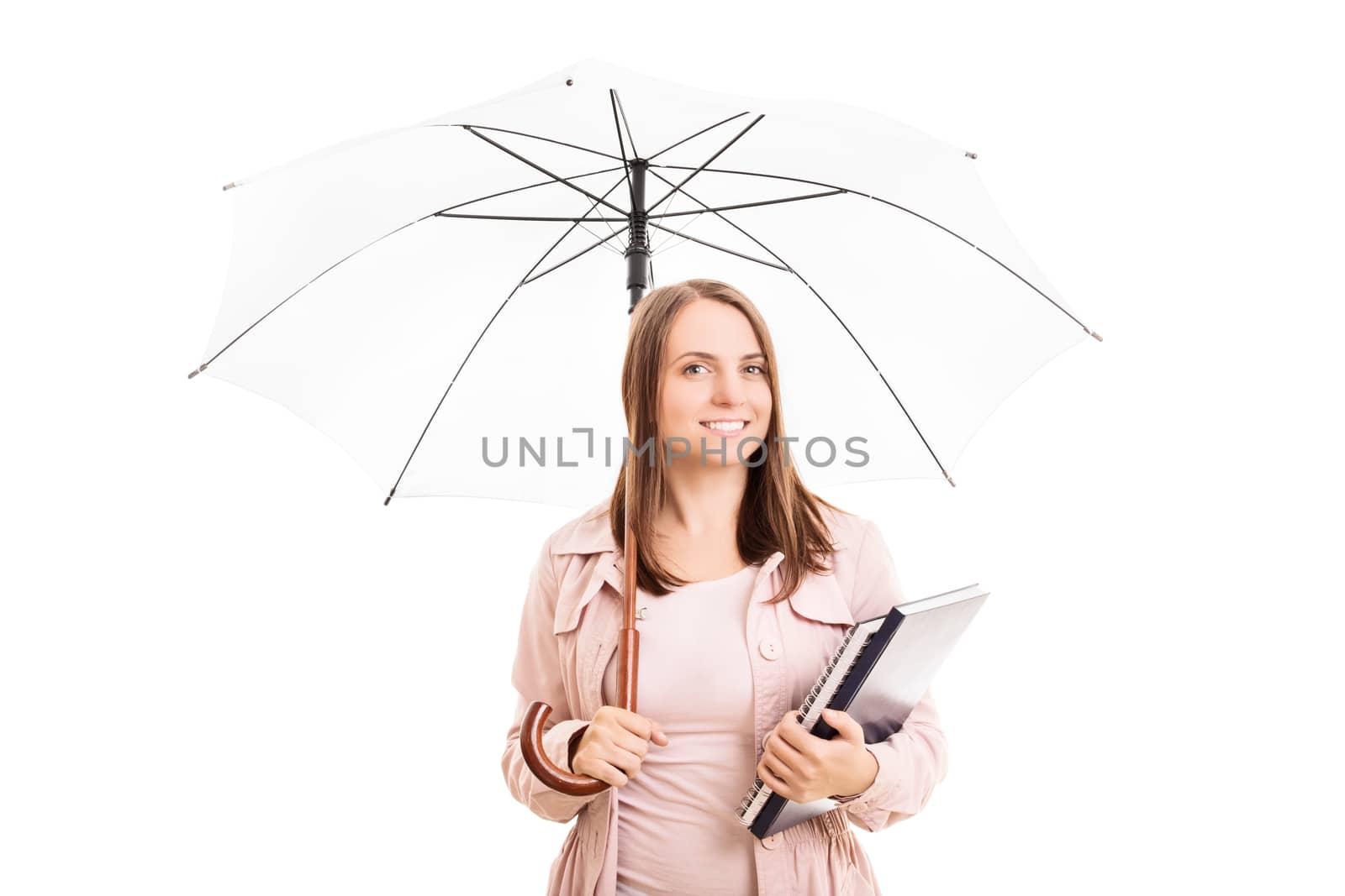 Young girl under an umbrella holding some books, isolated on white background.