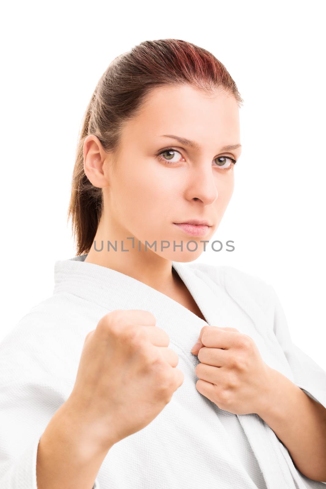 A close up portrait of a young girl in kimono with the fists up, isolated on white background.