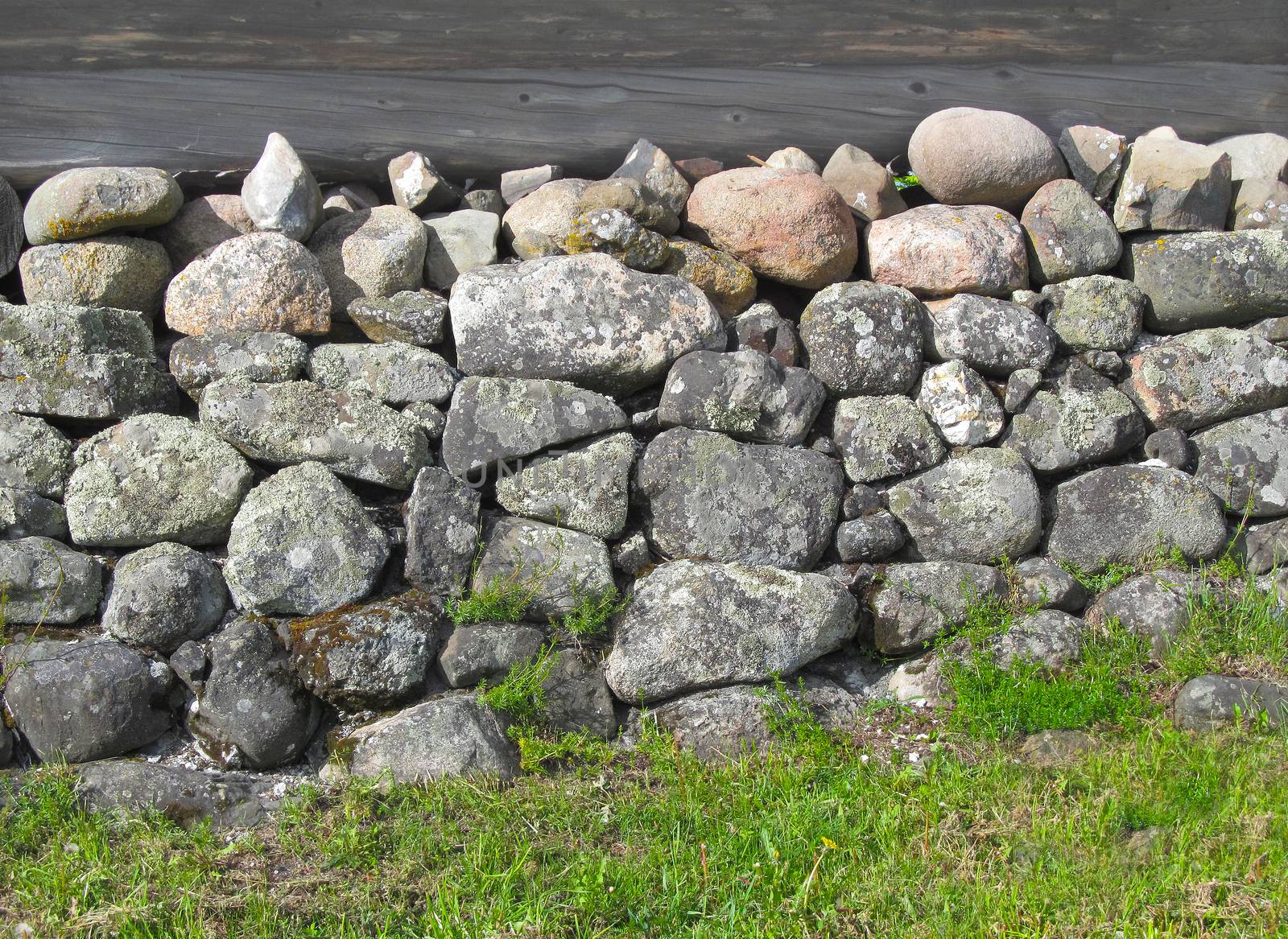 Ancient Foundation for a wooden house of large granite stones of different shapes and sizes.