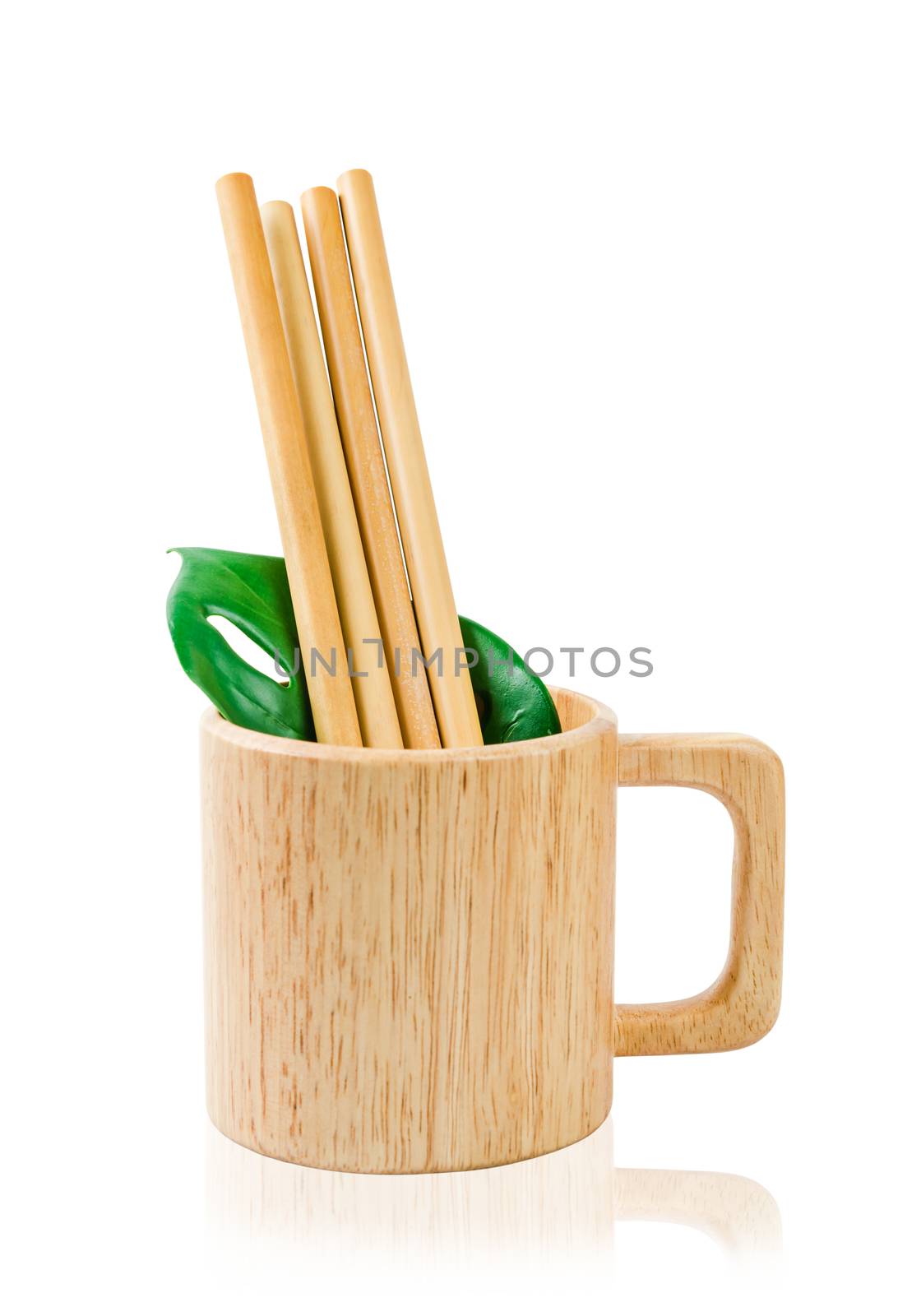 Biodegradable bamboo straws with wooden glass isolated on white background, save clipping path. Eco concept. Packaging straws made of bamboo.