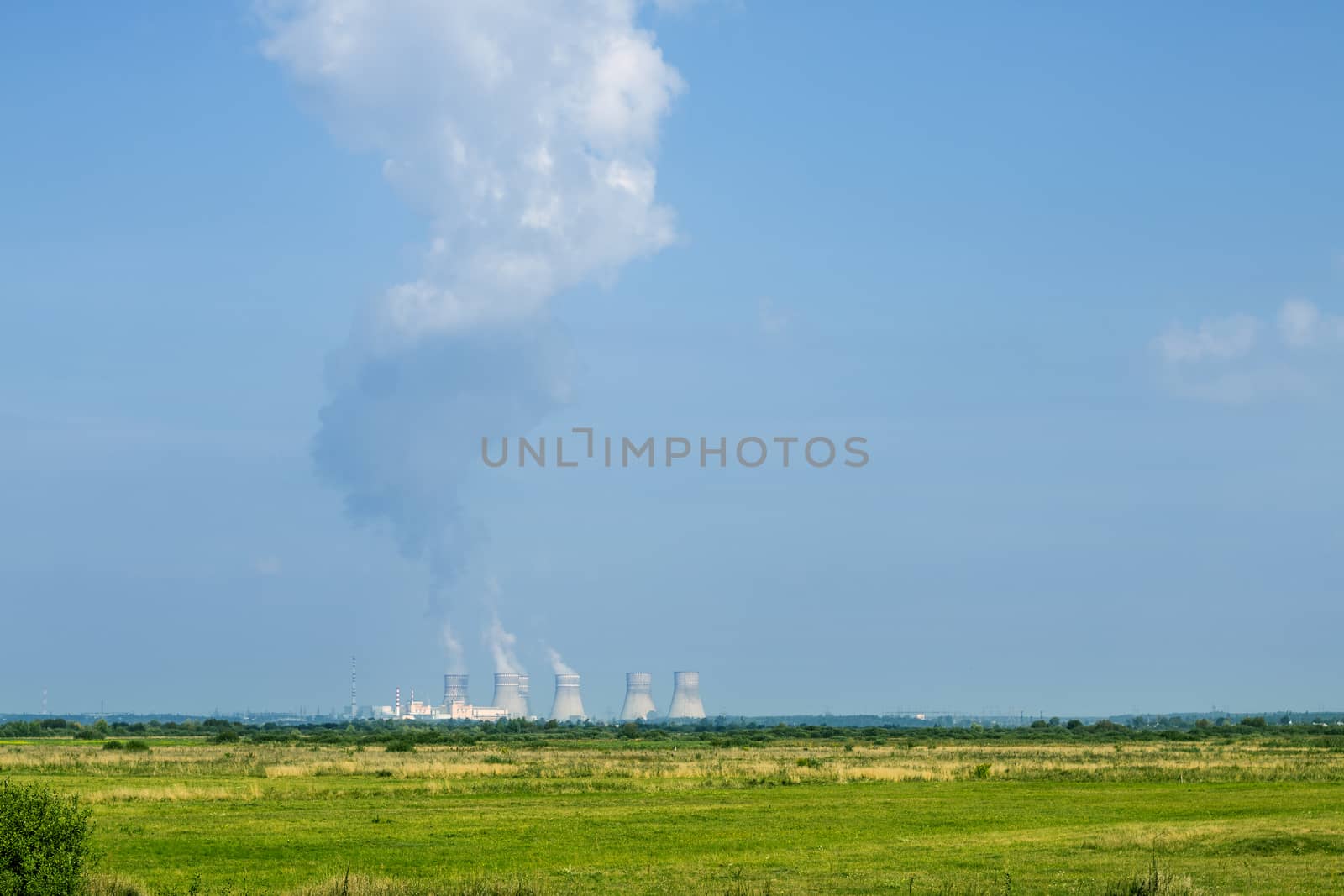 Nuclear station working far. Soviet NPP like Chernobyl. Power plant produces electricity