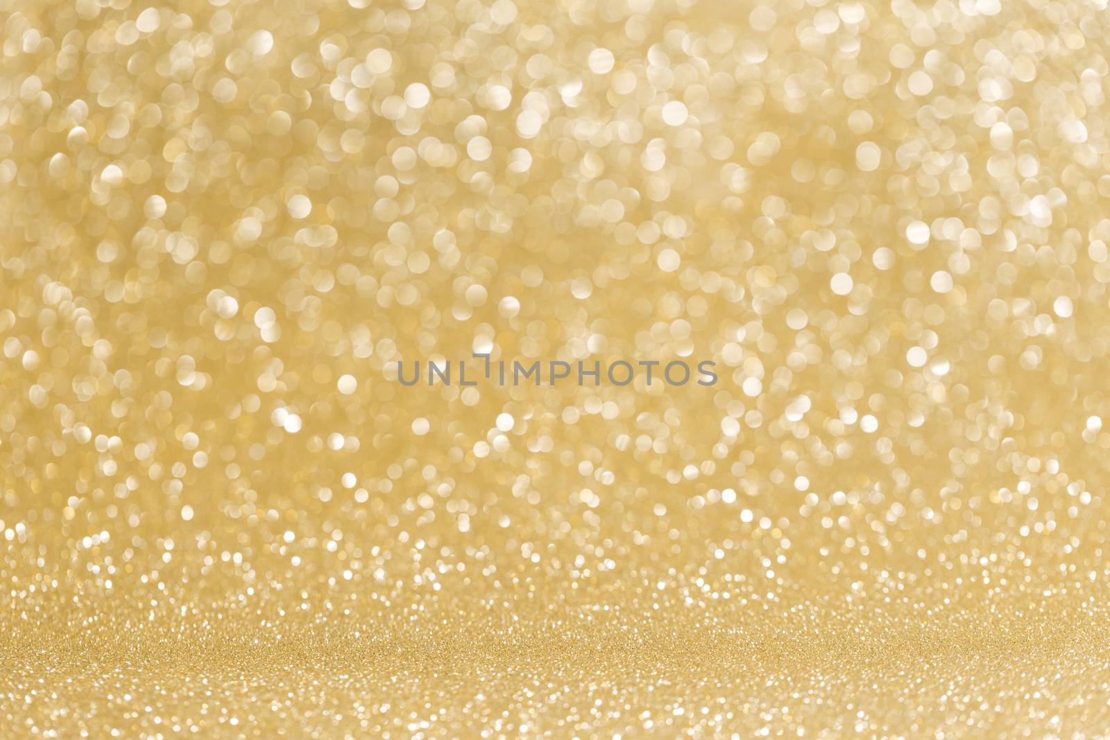 Abstract shining glitters golden holiday bokeh background with copy space for text
