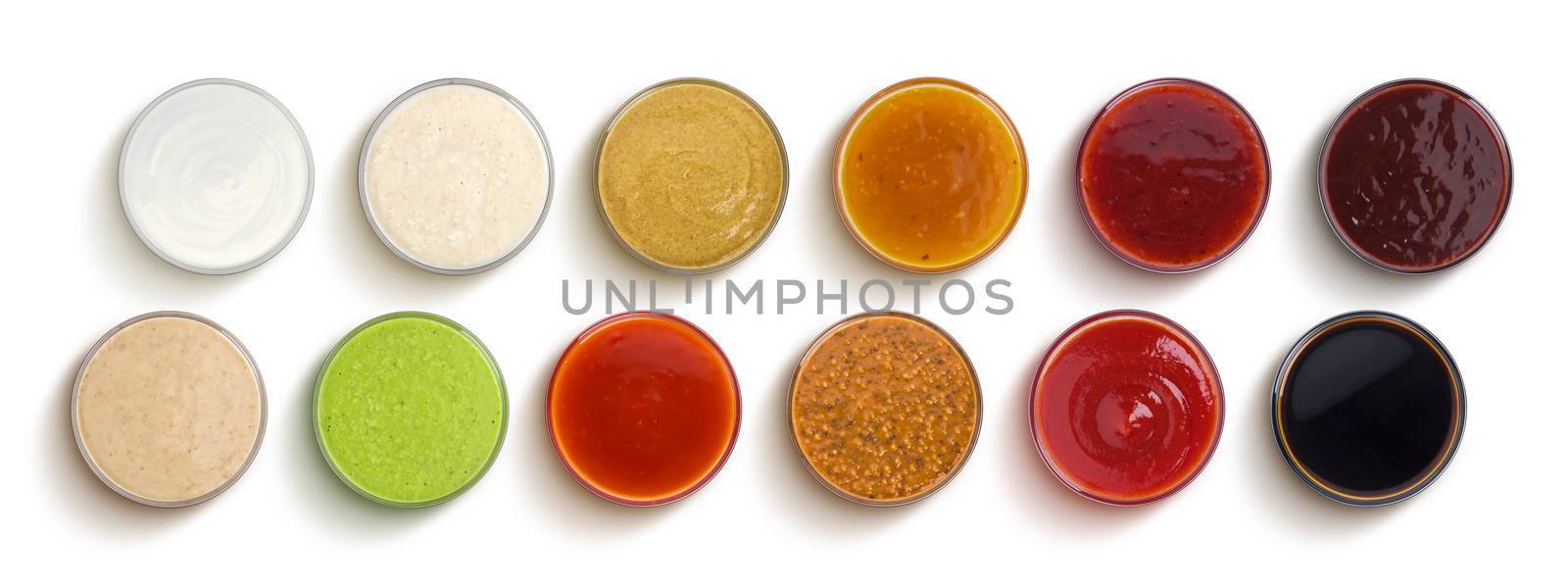 Set of different sauces isolated on white background, top view