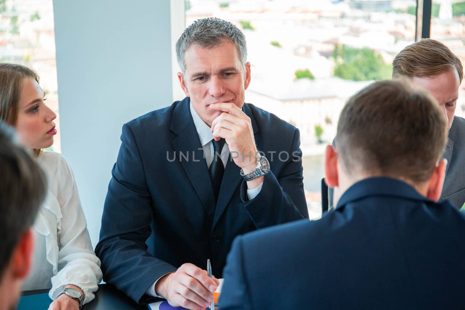Serious business people thinking at meeting at office table
