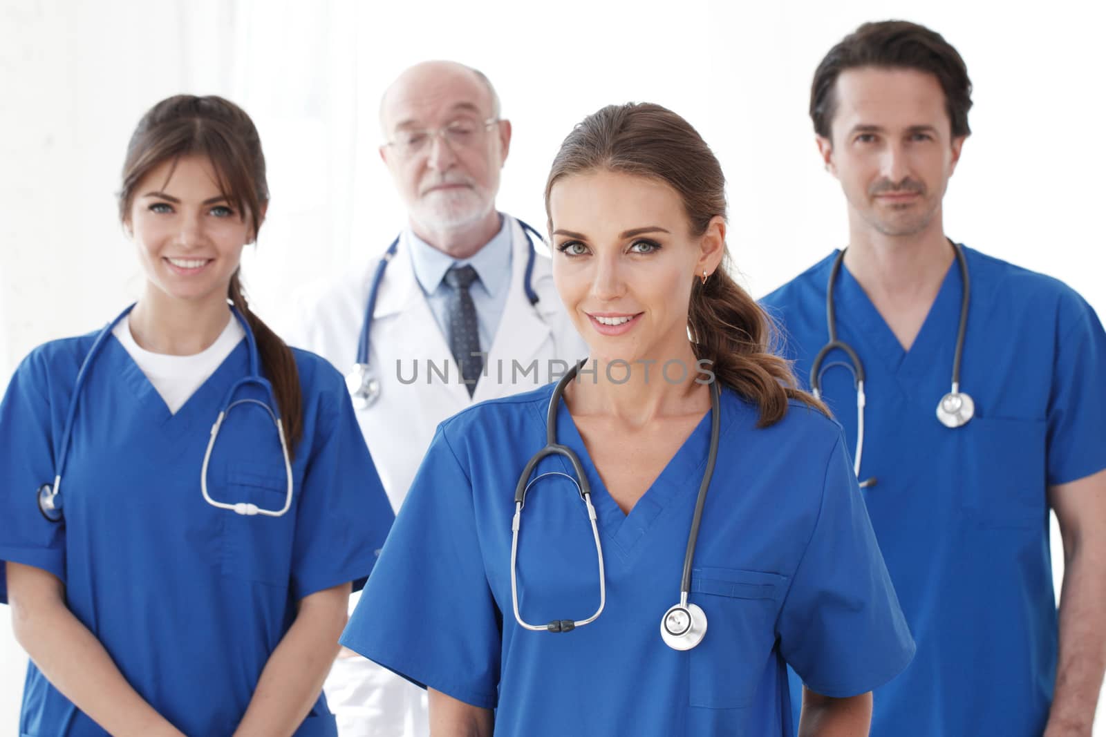 Team of professional doctors isolated on white background