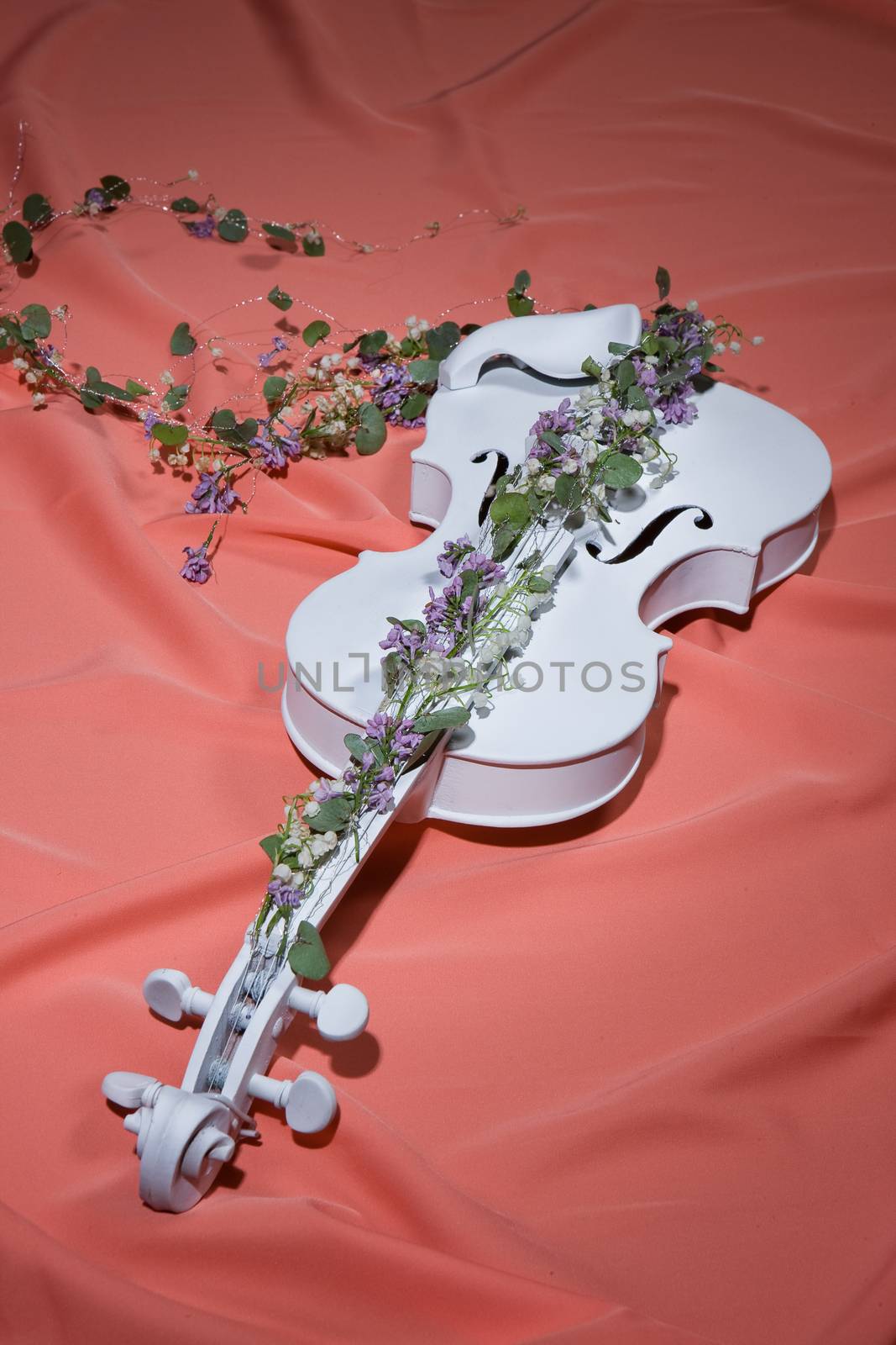 White decorative violin and flower composition