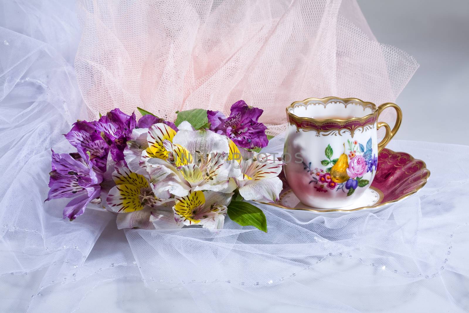 Cup of tea and bouquet of flowers