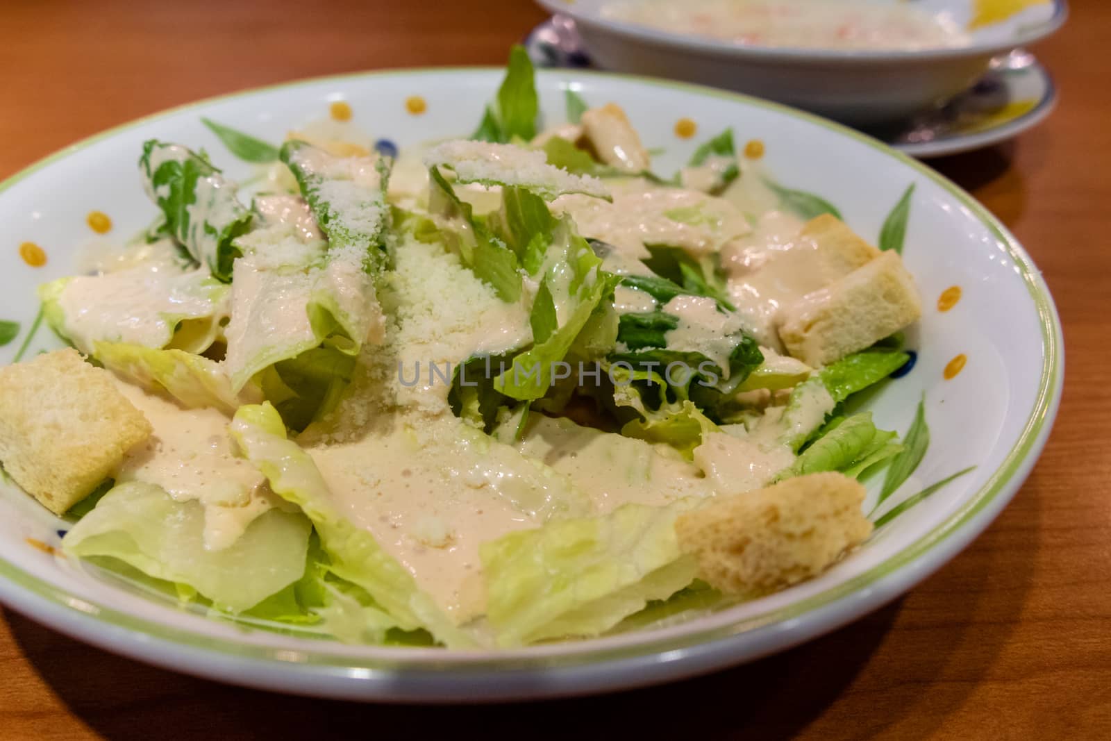 Green leafy salad with croutons in a plate
