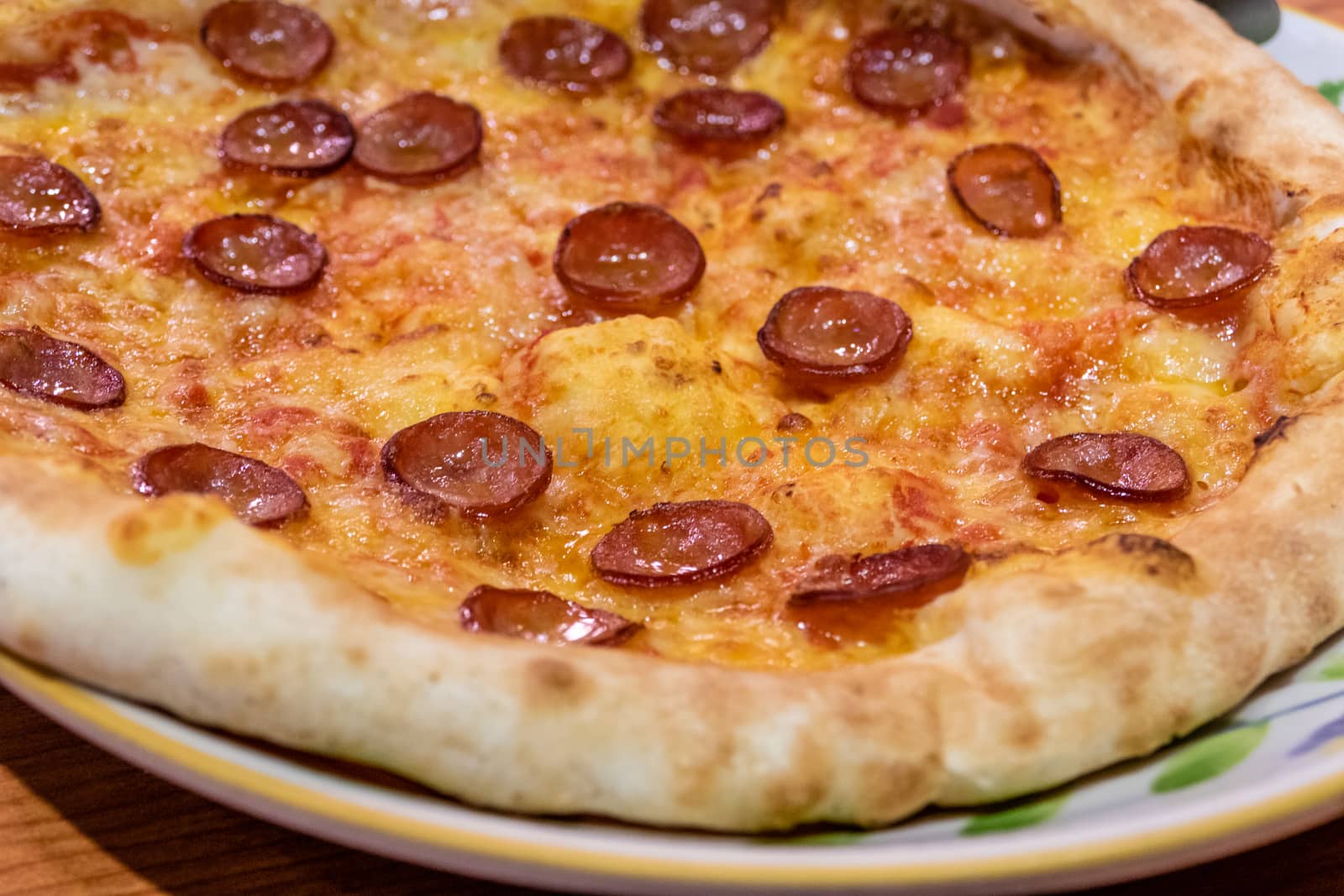 Chorizo sausage pizza with cheese in plate