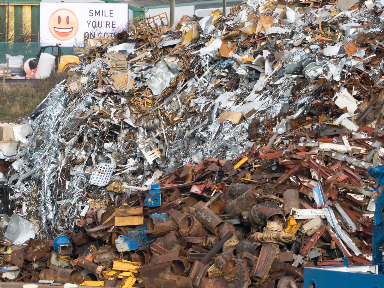 Large heap of scrap metal in scrap metal yard.