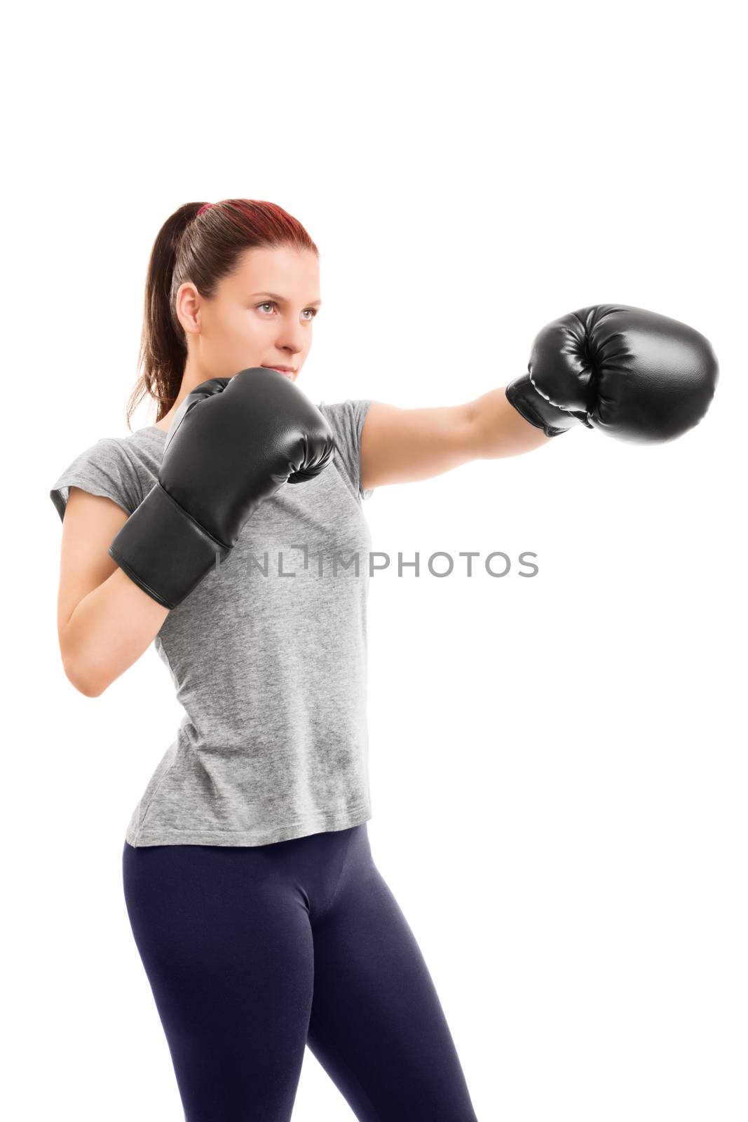 Beautiful young girl with boxing gloves punching by Mendelex