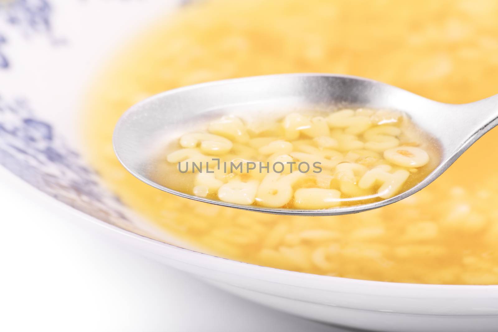 Close up of a bowl filled with alphabet soup by Mendelex