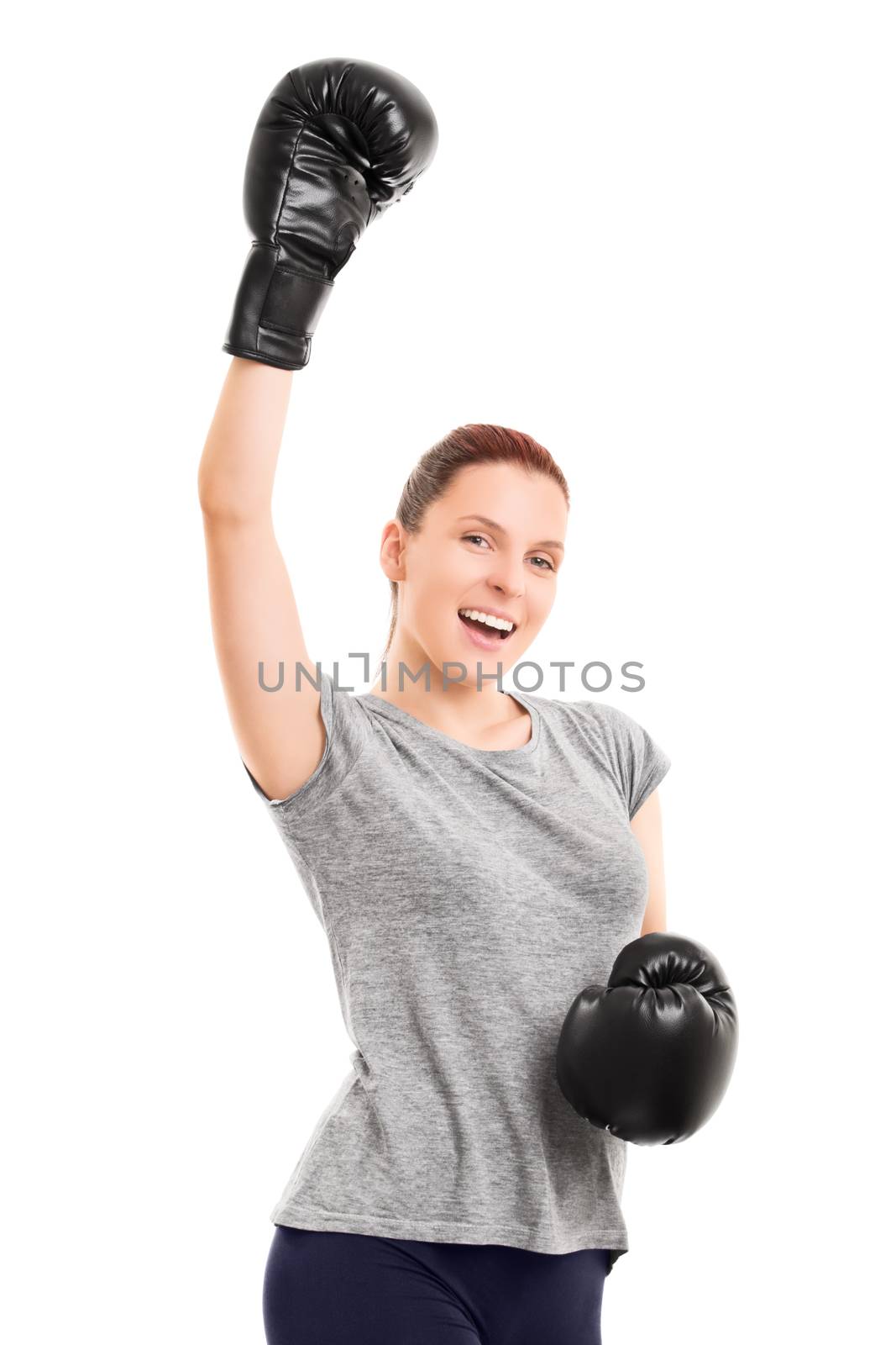 Fit young girl with boxing gloves cheering by Mendelex