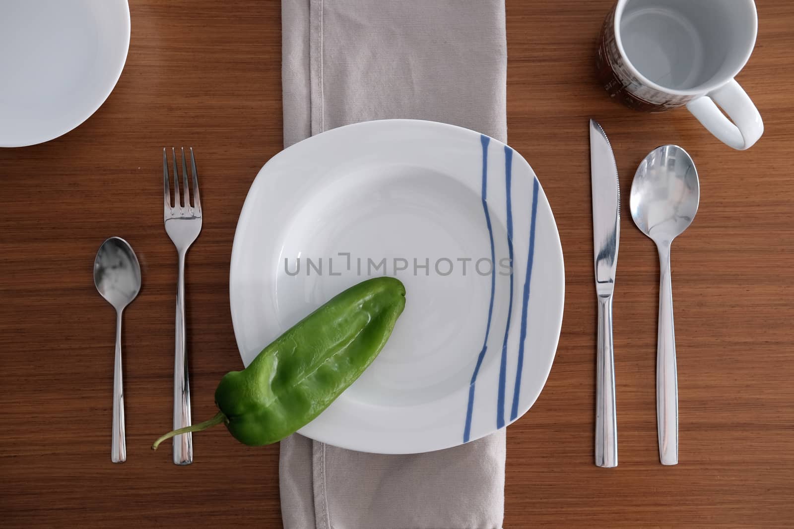 Table set for one diner on a wooden table by mikelju