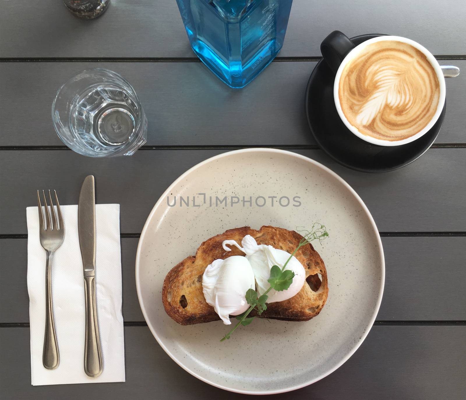 Poached eggs on toast with coffee by lovleah