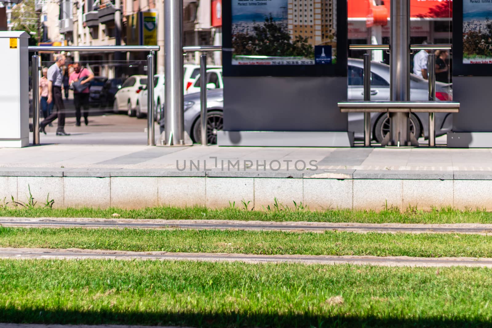 a shoot from tram station with green grasses. photo has taken from izmir/turkey.