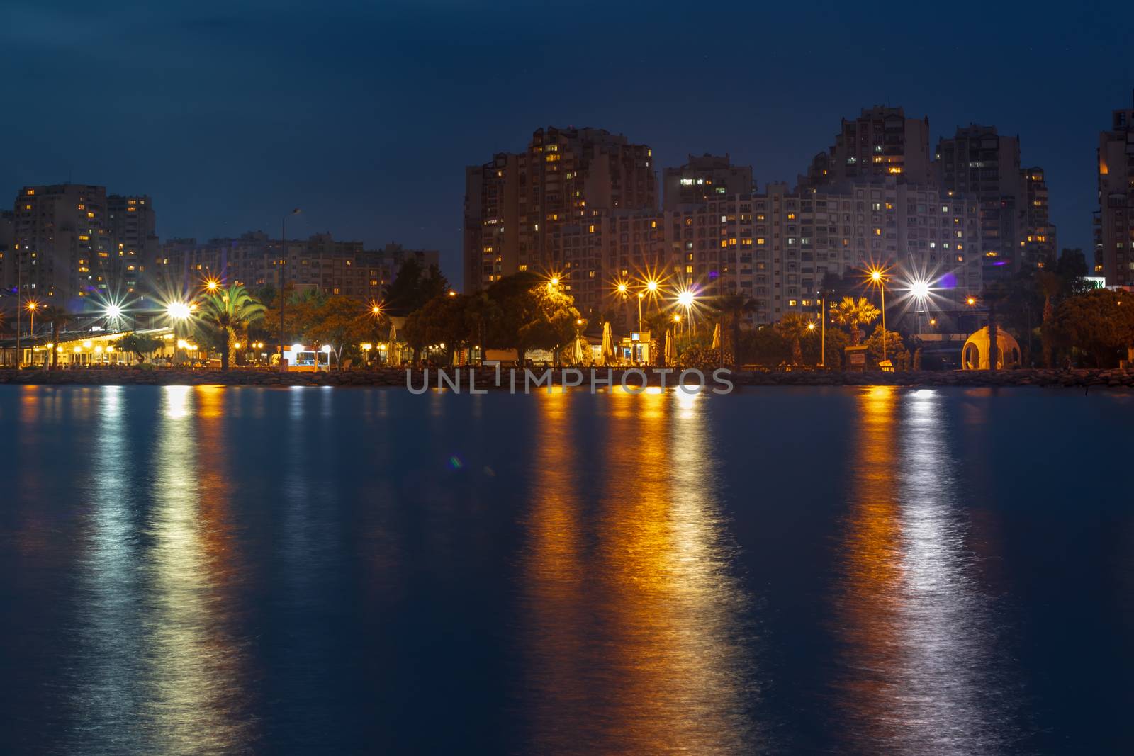 a wide long exposure cityscape shoot from izmir city - dark pastel colors. photo has taken izmir/turkey.