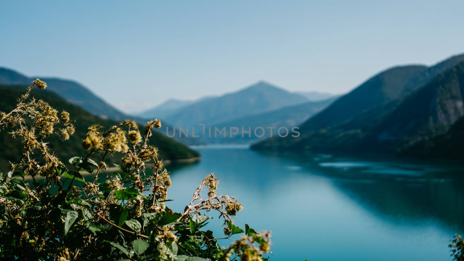 Zhinvali reservoir lake landscape with mountains. The main Caucasus ridge. by natali_brill