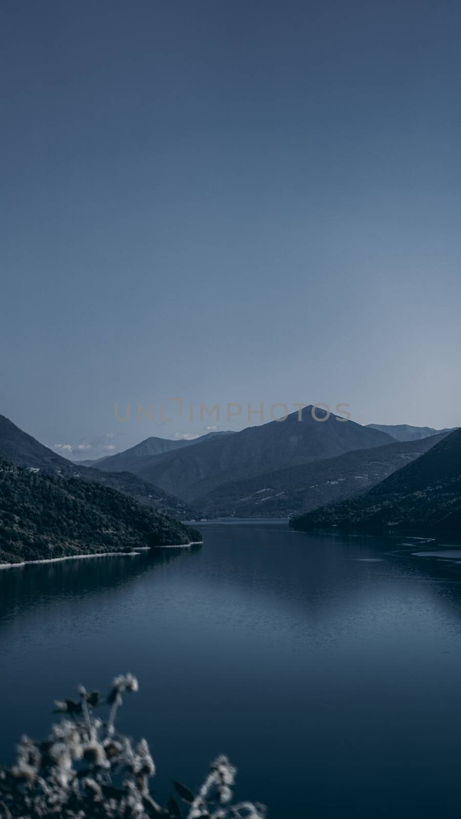Zhinvali reservoir lake landscape with mountains . The main Caucasus ridge.