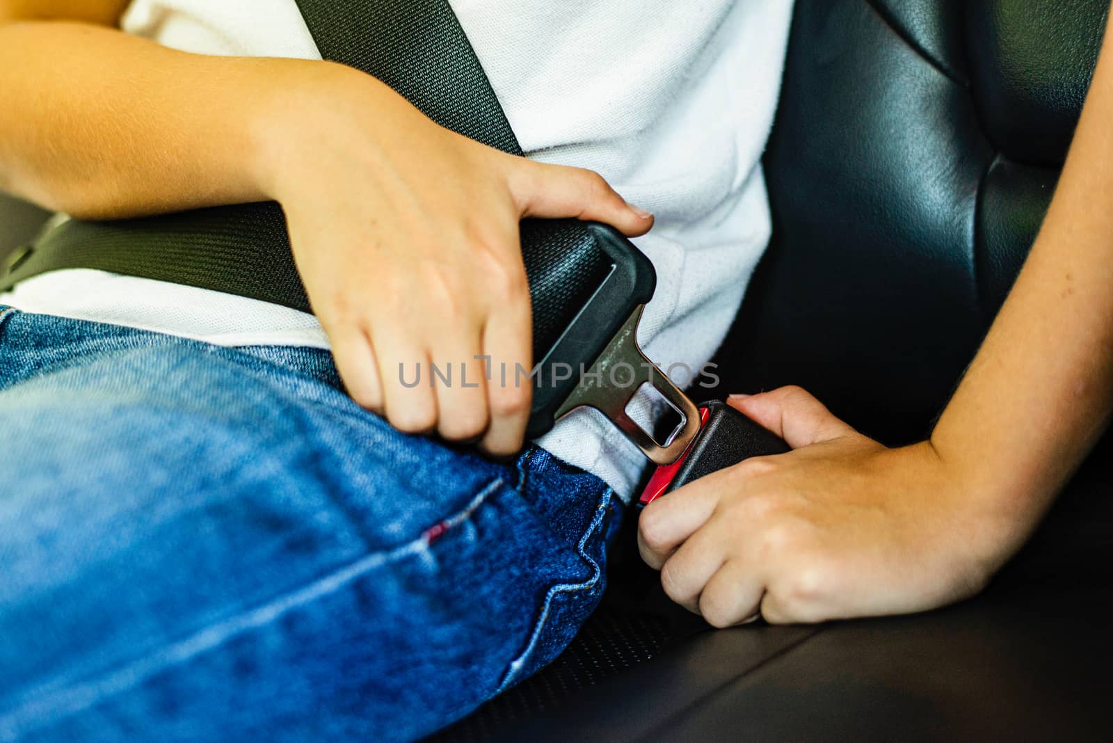 Man in righthand drive car wearing seatbelt