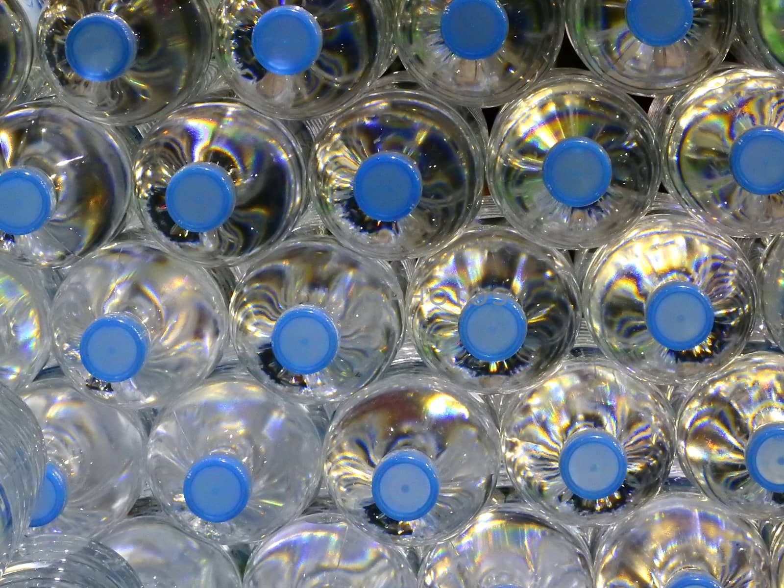 Close Up on mineral water bottles in top view.