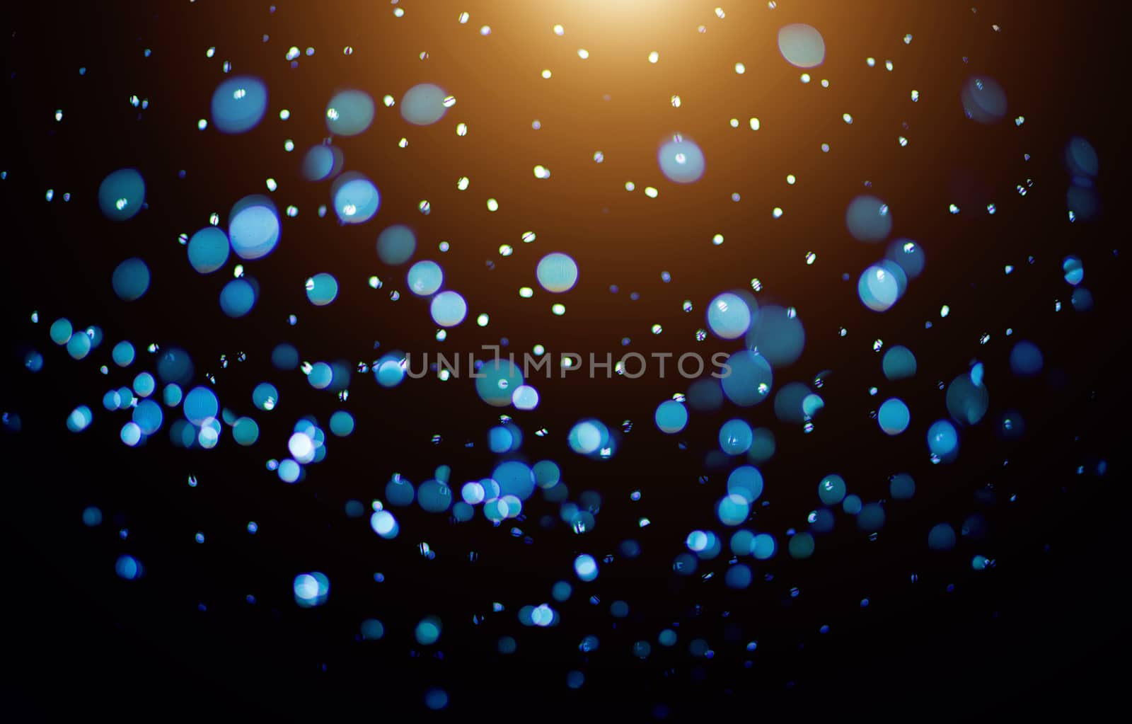 Blue and orange color abstract bokeh background for technology theme design.