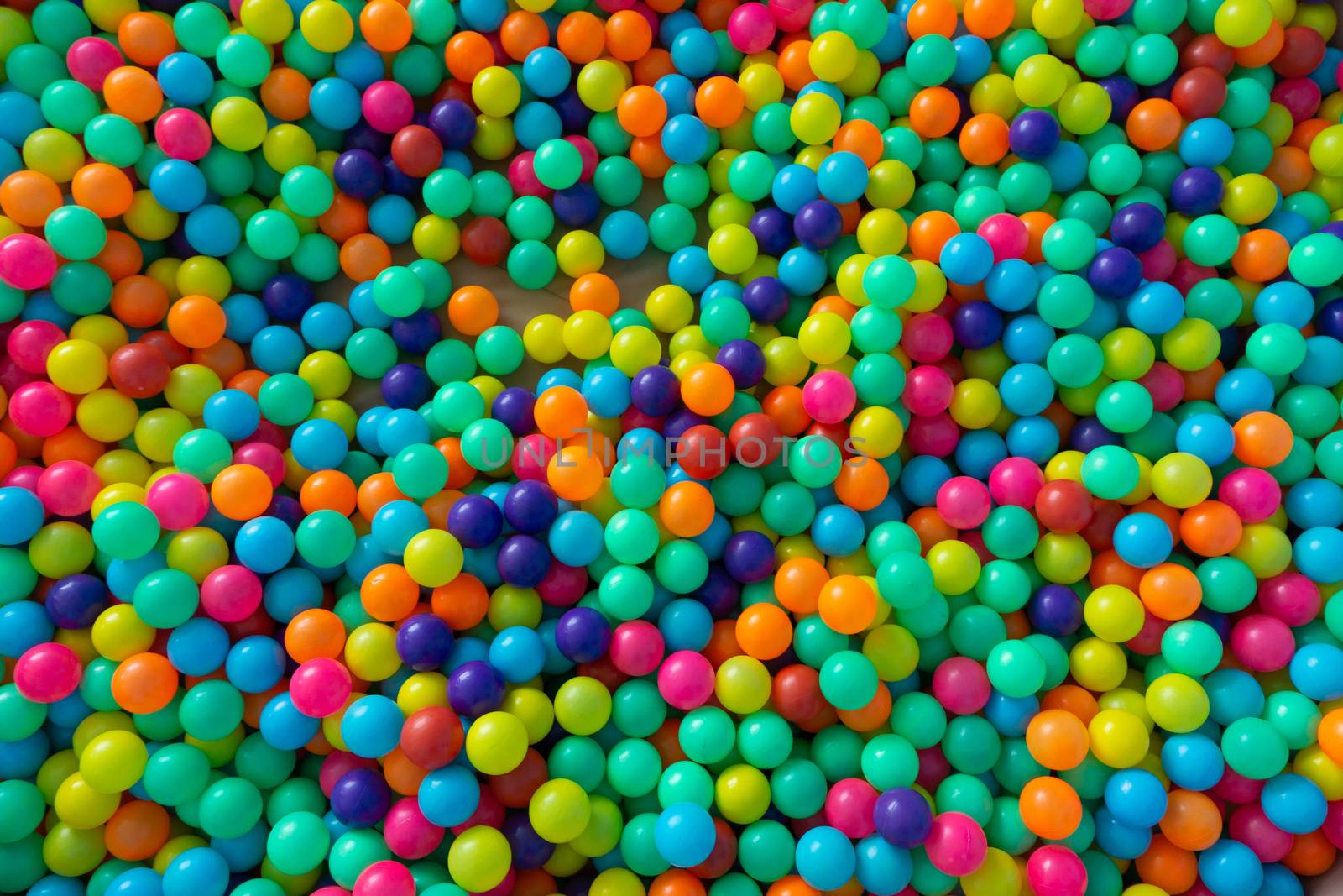 Colorful plastic balls for children playing in playground room by pkproject