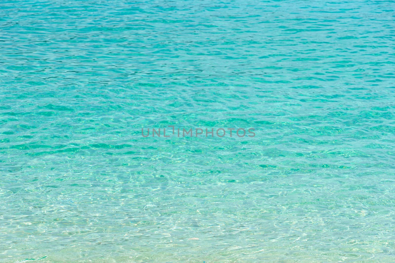 Tropical summer beach and transparent blue sea water background. Thailand sea.