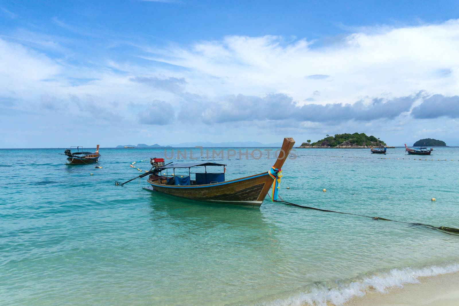 Long-tailed boat on Sunrise Beach, Koh LIPE, Satun, Thailand. by pkproject