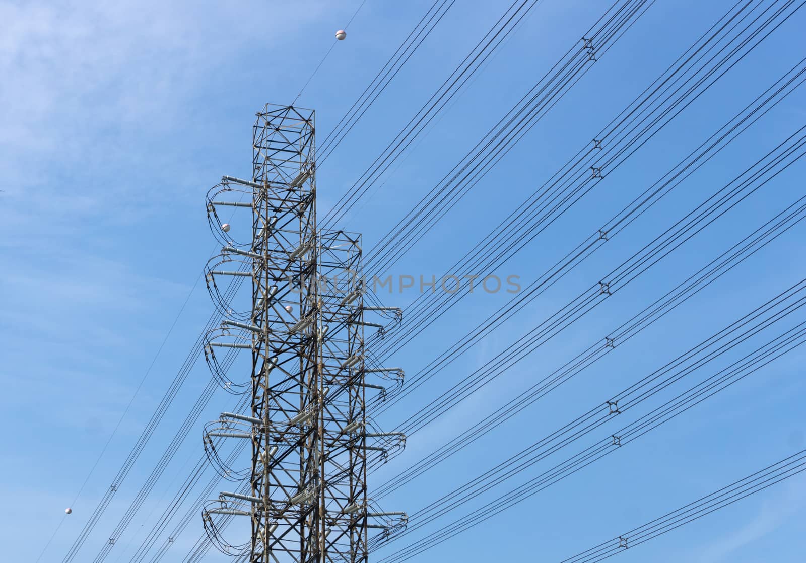 High-voltage of power transmission towers on blue sky background by pkproject