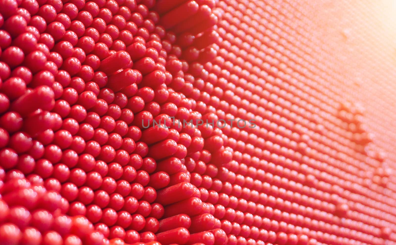 Abstract dots background in red colors. Red is the color of fire and blood, so it is associated with energy, war and danger.
