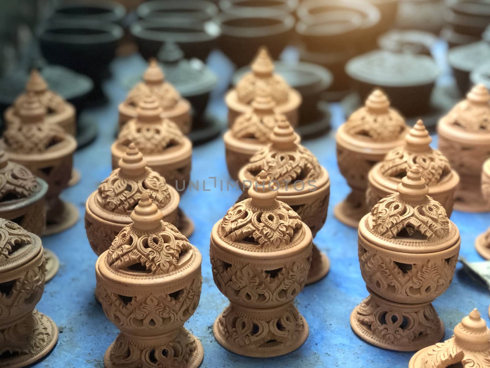 Handmade glazed pottery and carved in Thai art style by pkproject