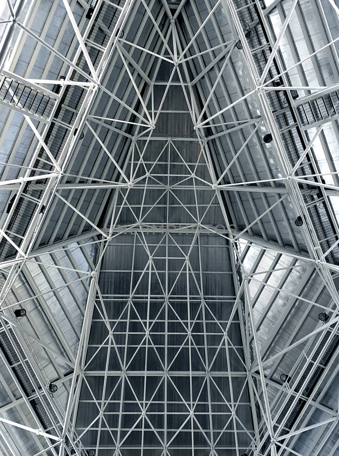 Abstract metal structure roof interior in blue soft and white.