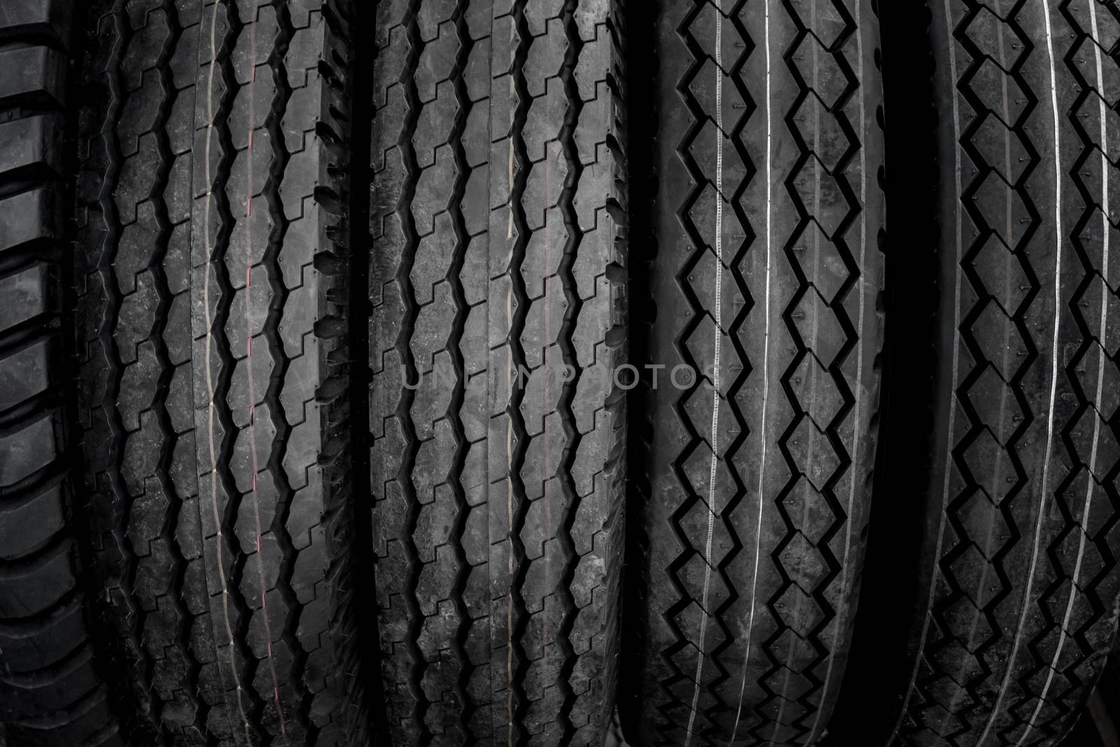 The background and texture of large tires that have been used and repaired for re-use.