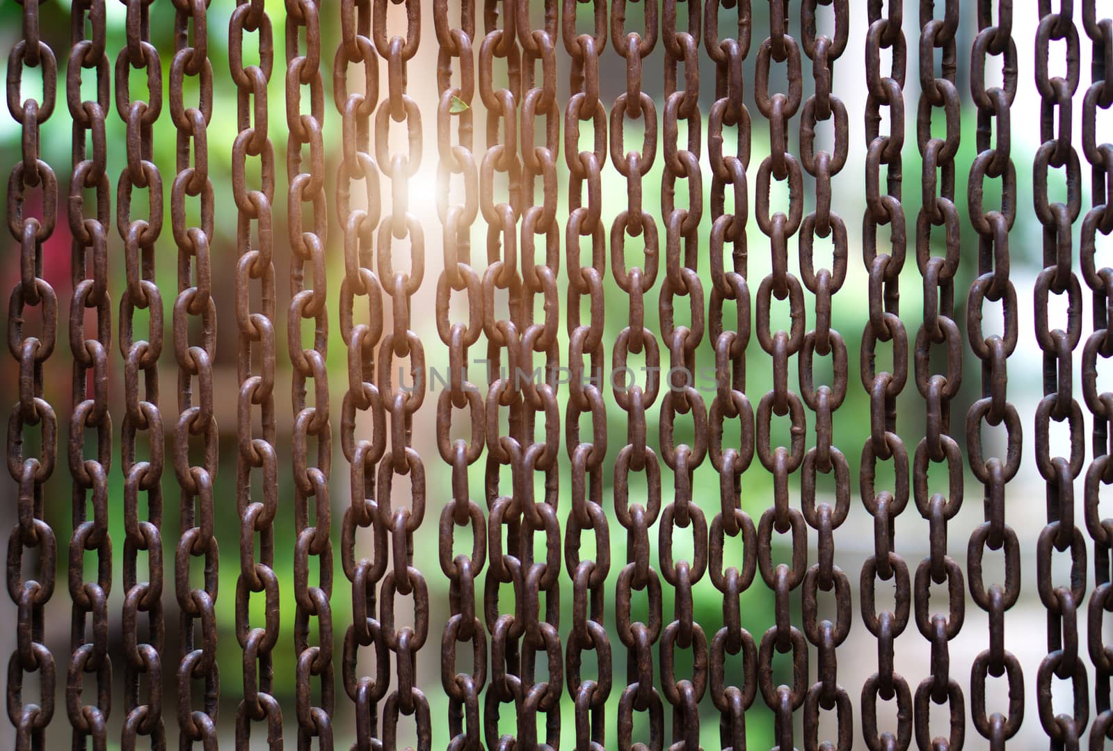 Full Frame Shot Of Metallic Chain and sunlight background.