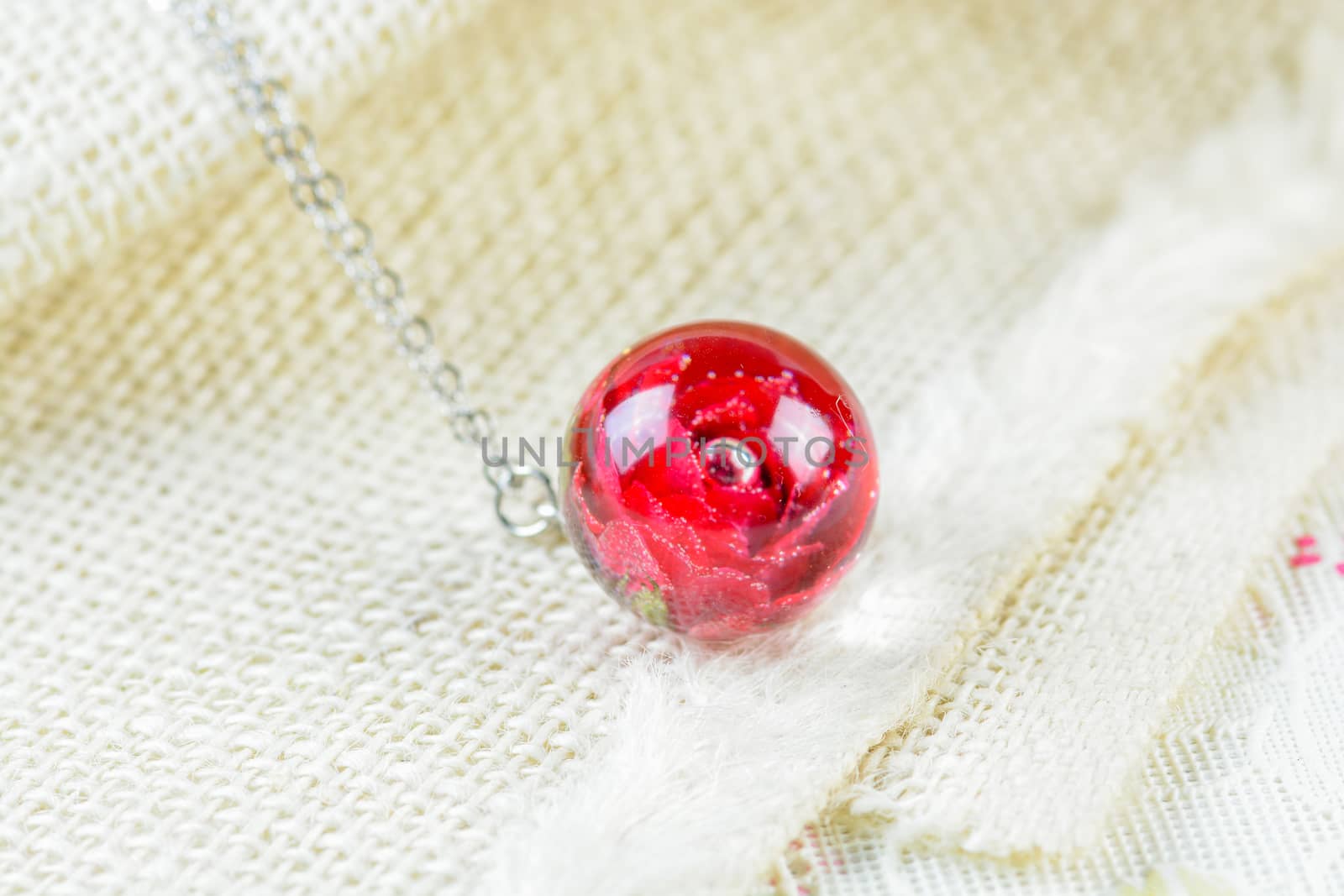 Dried rose in crystal clear resin pendant necklace, pendant with a real rose. 
