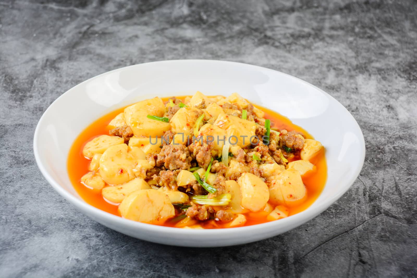 Mapo Tofu, popular Chinese dish.  The classic recipe consists of silken tofu, ground pork or beef and Sichuan peppercorn to name a few main ingredients.
