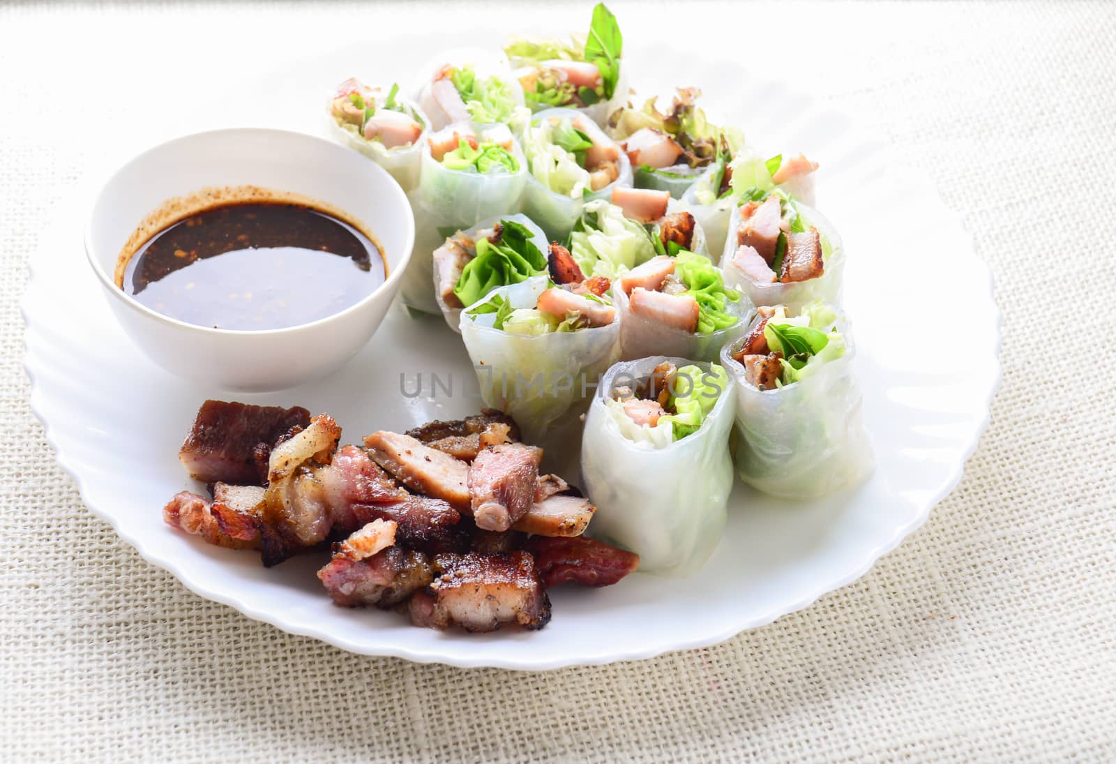 Fresh assorted Asian spring rolls with grilled pork, fresh vegetable. Healthy and delicious dish
