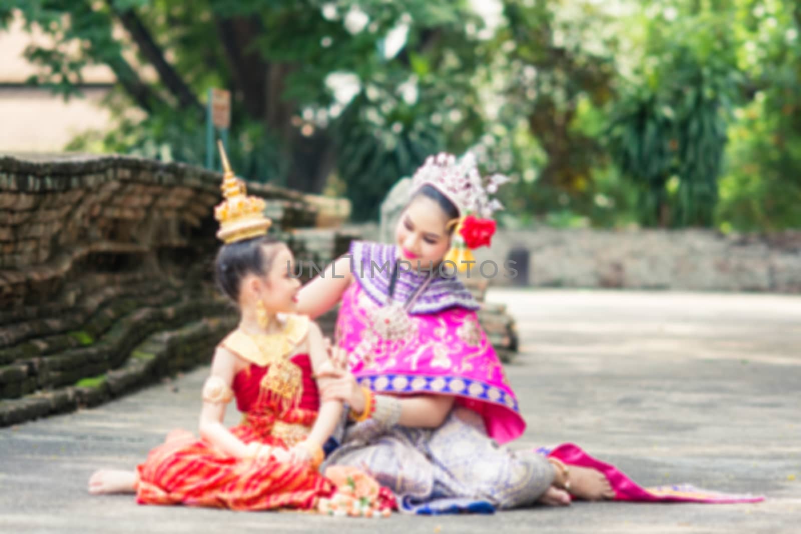 Asian woman wearing typical, traditional Thai Dress. It is liter by yuiyuize