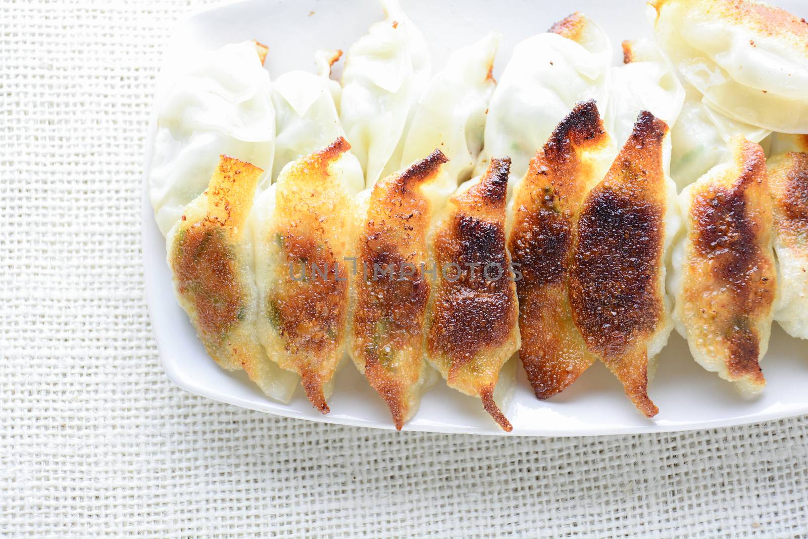 Japanese Fried Dumplings, the half moon-shaped dumplings served in Asian restaurants as an appetiser or side dish, pork and vegetable filling.
