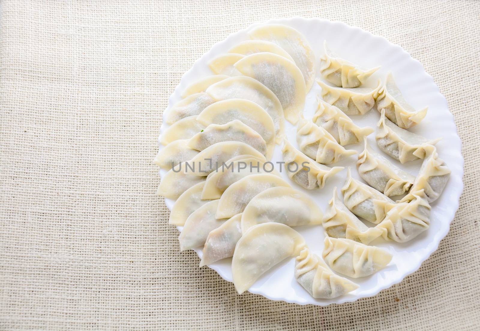 Japanese Fried Dumplings, the half moon-shaped dumplings served in Asian restaurants as an appetiser or side dish, pork and vegetable filling.
