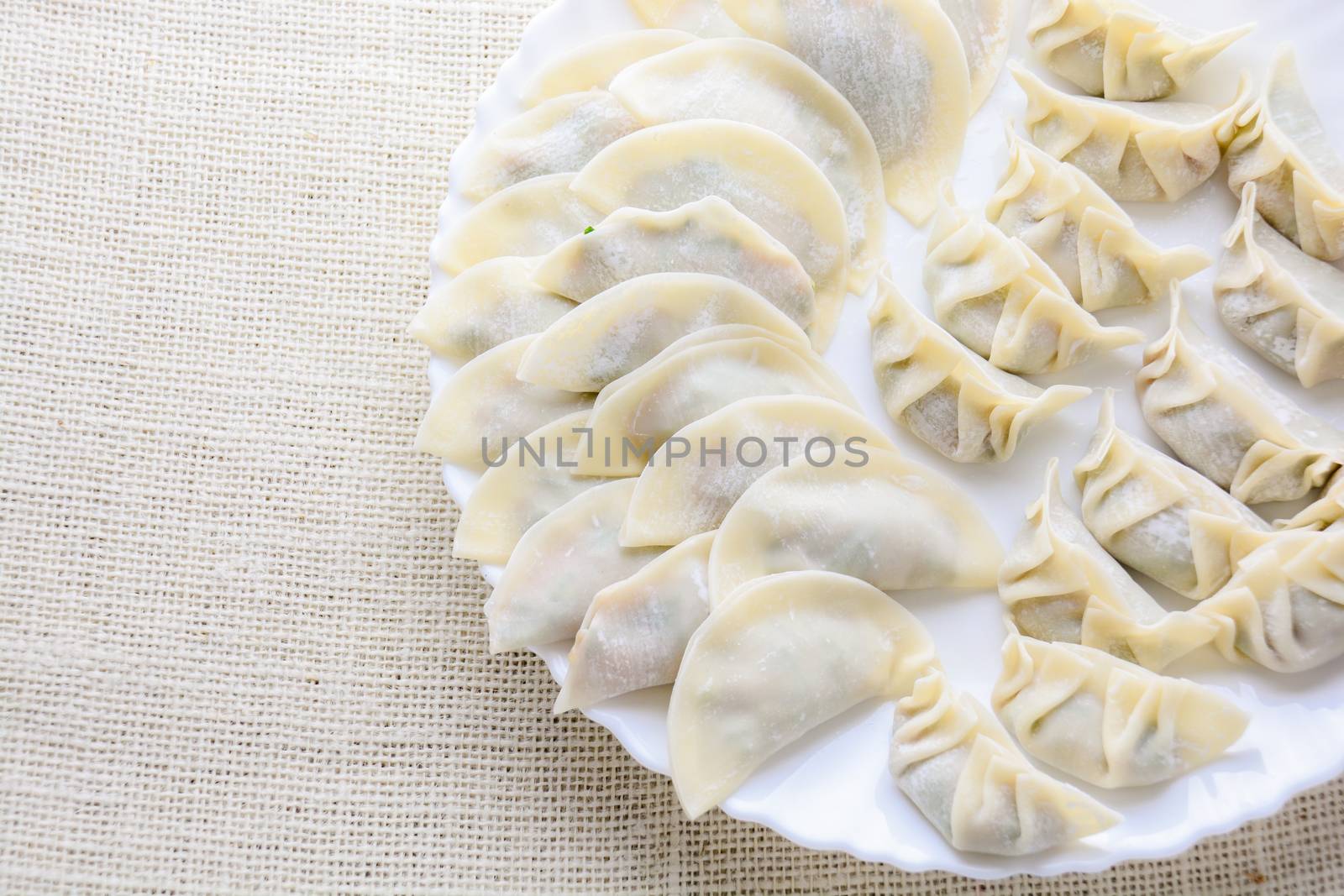 Japanese Fried Dumplings, the half moon-shaped dumplings served in Asian restaurants as an appetiser or side dish, pork and vegetable filling.
