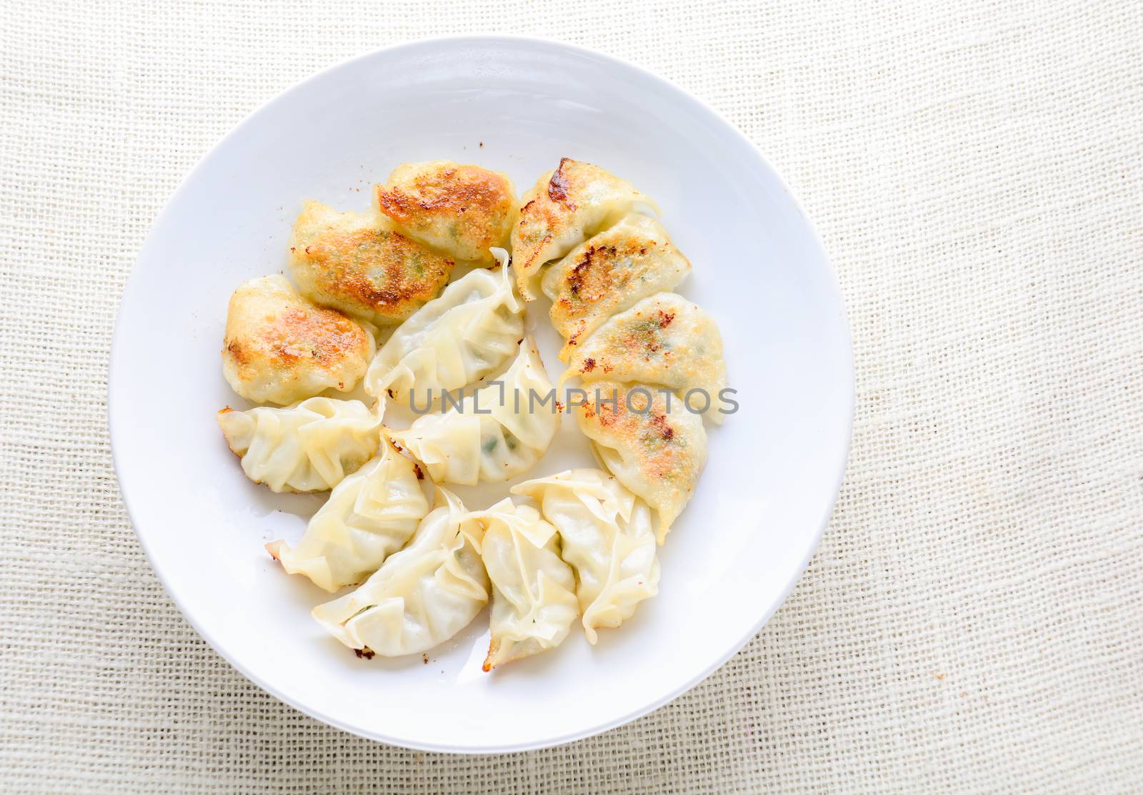 Japanese Fried Dumplings, the half moon-shaped dumplings served in Asian restaurants as an appetiser or side dish, pork and vegetable filling.
