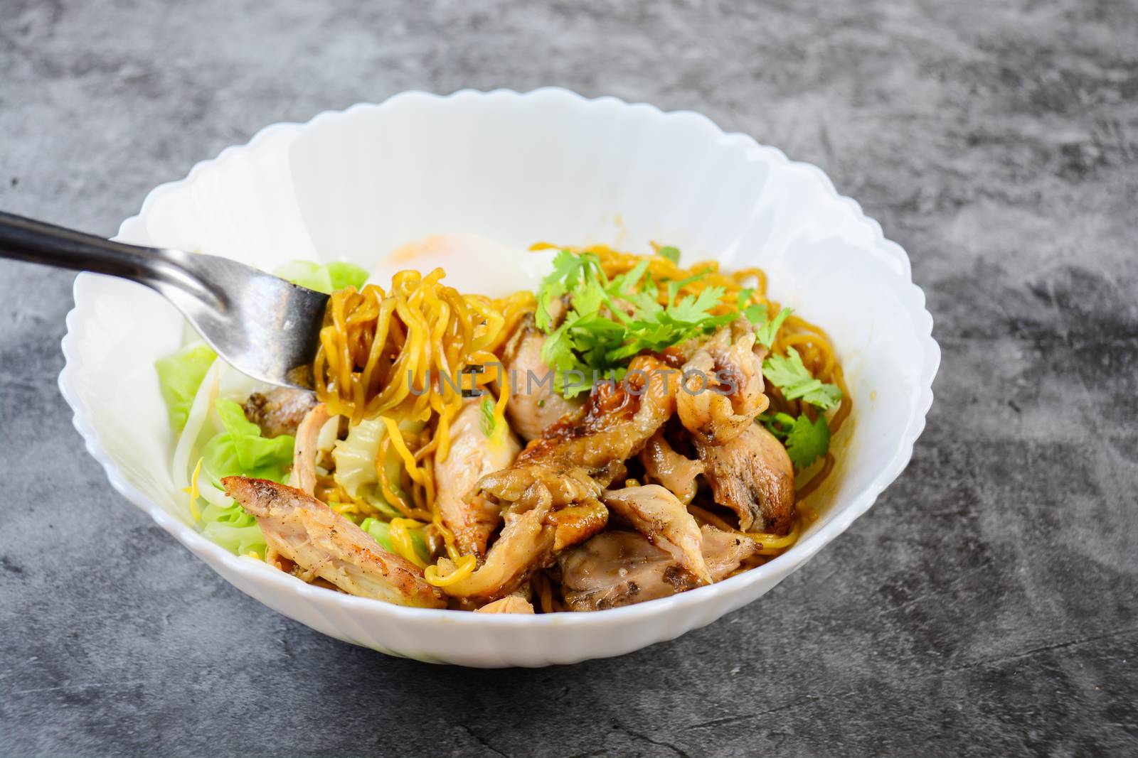 Egg noodles served dry with roasted honey chicken and soft-boiled eggs (onsen tamago eggs)
